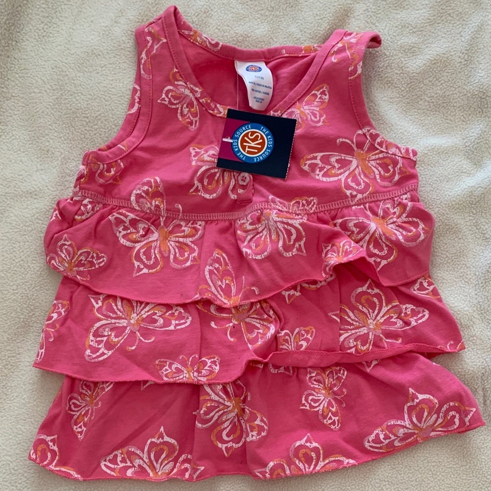 Sleeveless pink tiered ruffle shirt with butterfly pattern